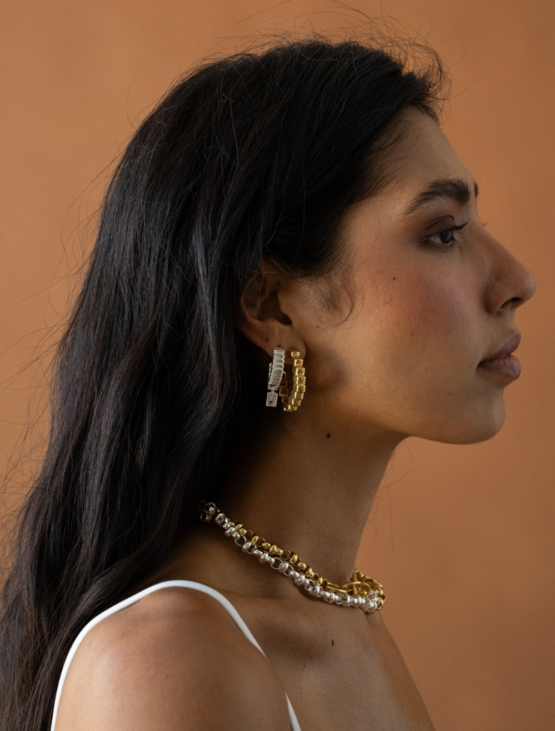 Gold Gabrielle earrings designed with graceful lines and a lustrous finish, ideal for formal or casual occasions.