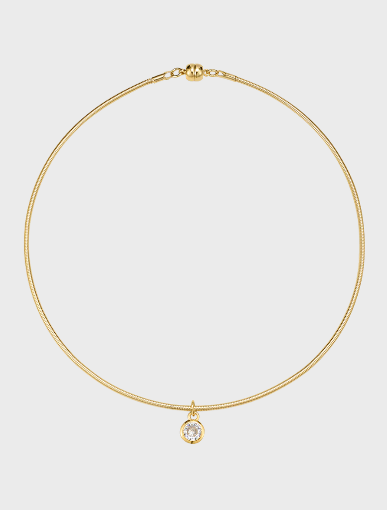 Gold choke necklace featuring a diamond charm, named the Georgia Stone Omega Necklace.