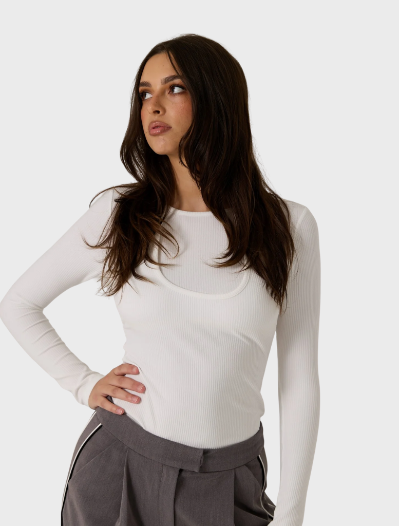 Chic white double layer top, offering a modern silhouette and ideal for layering with other clothing items.