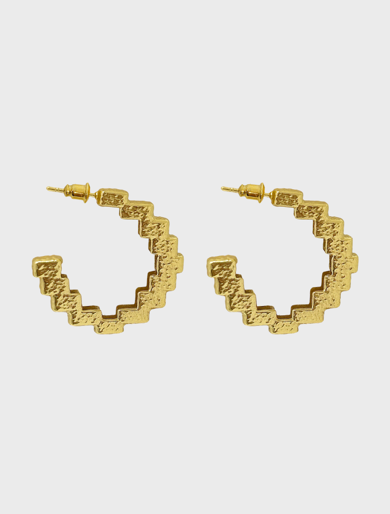 Chic gold Gabrielle earrings showcasing a unique design, suitable for both everyday wear and special events.