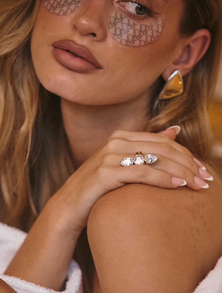 The Marais Triple Statement Ring features three diamond stones set in gold and white gold.
