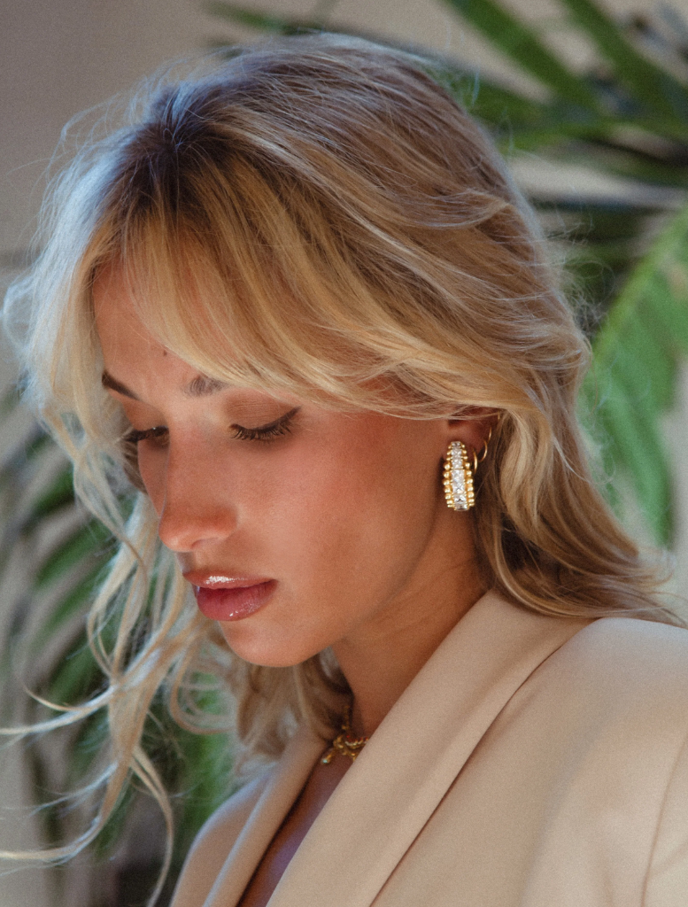 Gold Marilyn earrings with a chic design, ideal for enhancing your jewelry collection and complementing outfits.