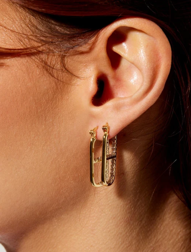 Gold OG Earrings featuring clear crystals, inspired by the LOVE DRUG PILL necklace, with profits supporting GIRLS Inc.
