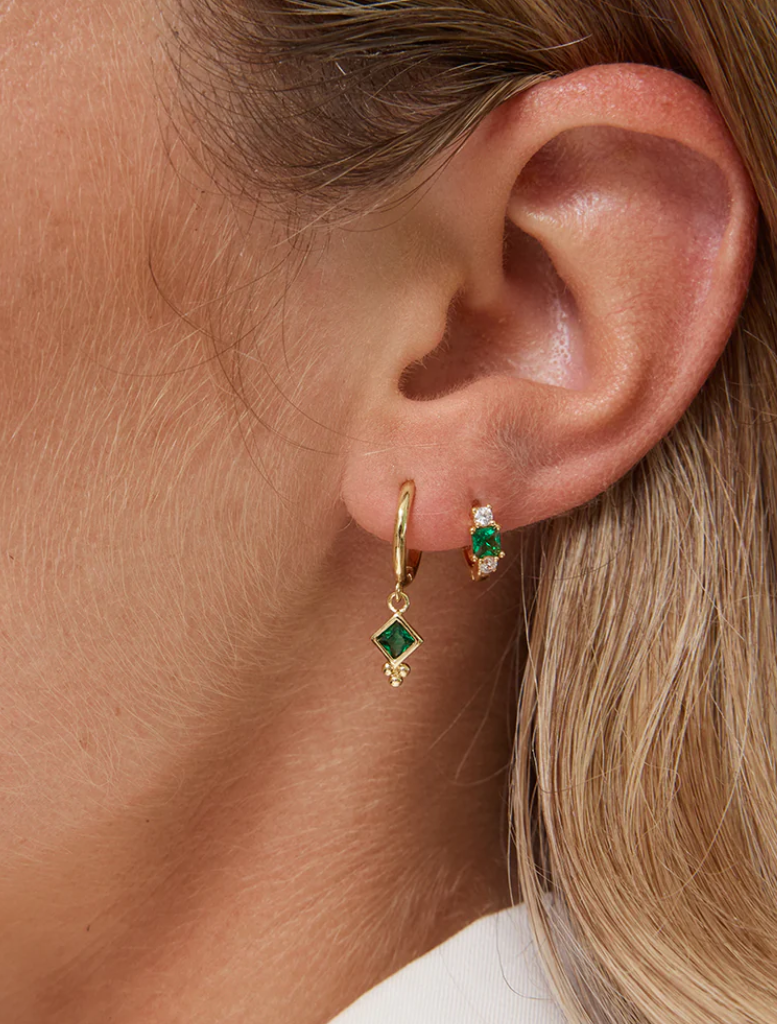 A pair of green Elsa Sleepers Earrings, highlighting their stylish and modern appearance against a neutral backdrop.