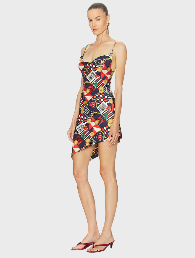 The Helga Dress showcased in a casino, highlighting its chic style and eye-catching details for a glamorous look.