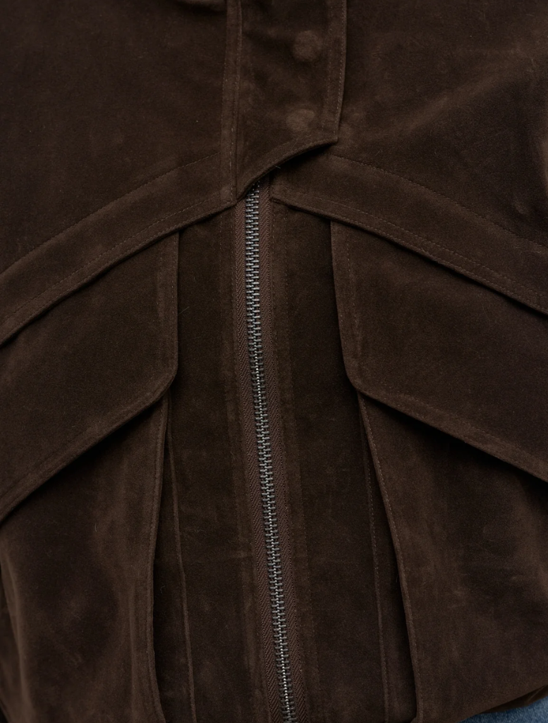 Elegant deep brown Inez jacket hanging, highlighting its contemporary style and versatile appeal for different outfits.