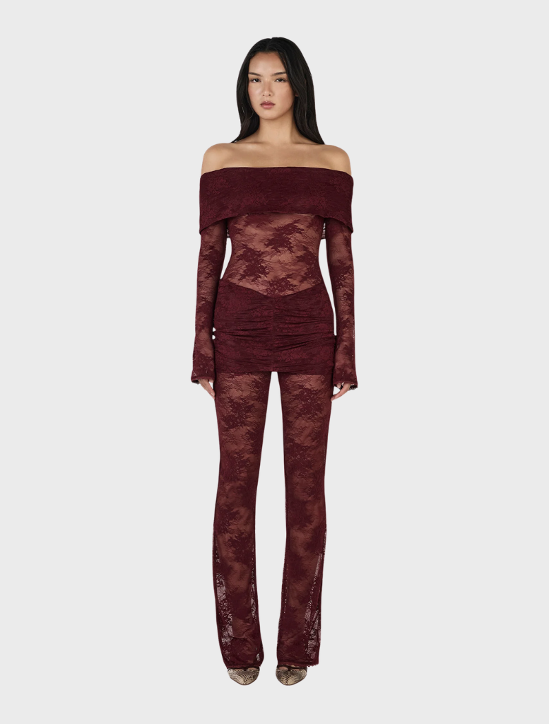 Elegant burgundy lace jumpsuit made from delicate lace, perfect for formal occasions.