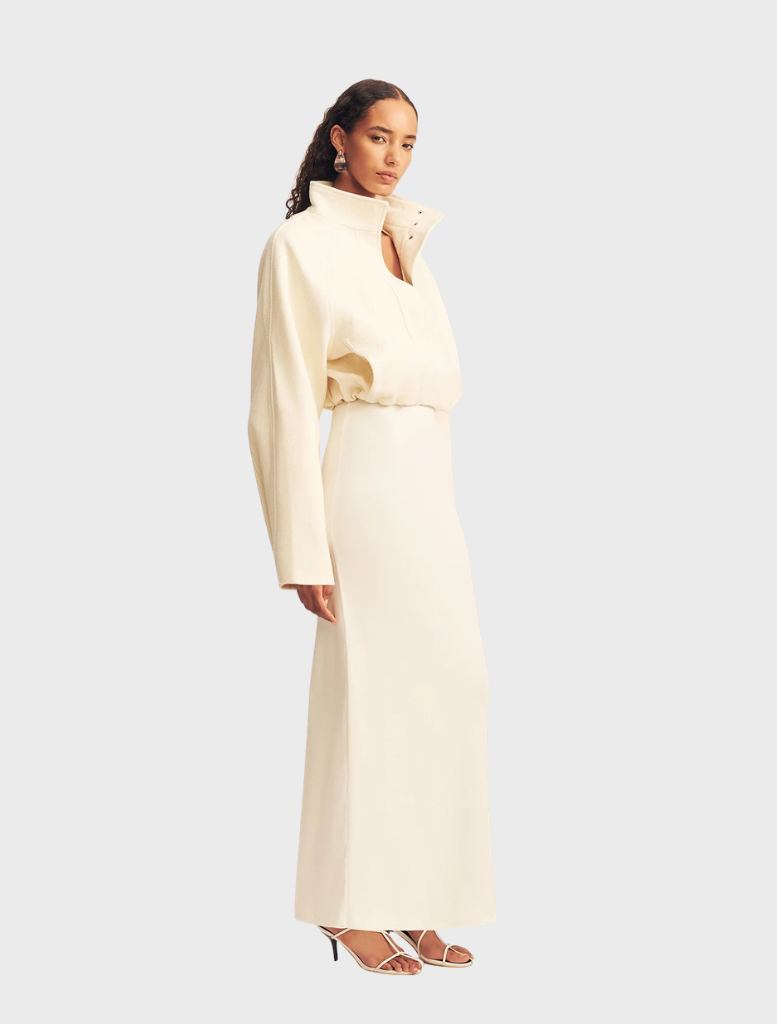 Chic ivory cropped bomber jacket, designed with a front zip closure and fitted cuffs for a contemporary look.