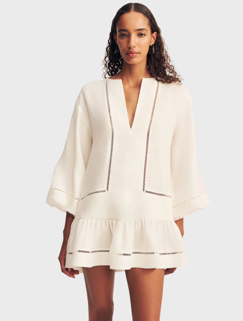 Elegant ivory mini dress showcasing balloon sleeves and a flattering silhouette, perfect for stylish summer outings.
