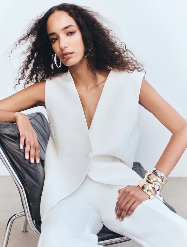 Ivory Otis Pant draped elegantly, emphasizing its modern style and color.