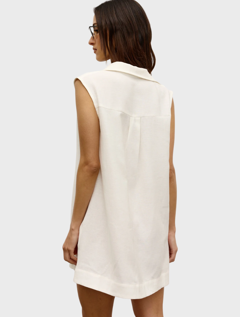 Back view of a woman in a white shirt dress, showcasing the Juno Dress design.