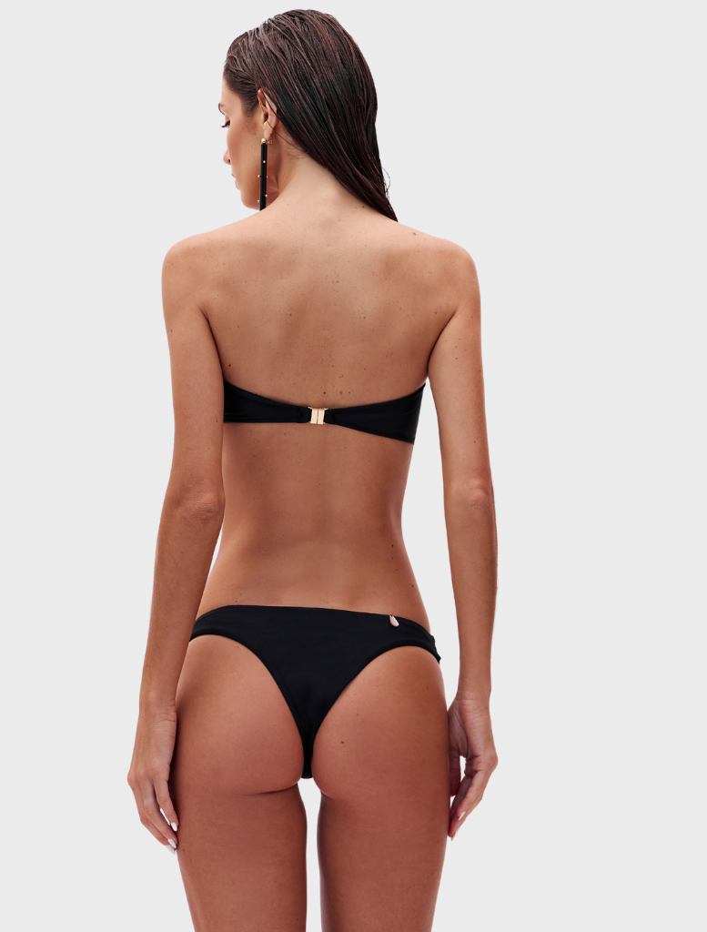 Elegant black Karima set consisting of a fitted top and coordinating pants, perfect for casual or formal occasions.