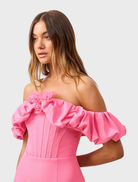 Stylish pink mini dress with off-the-shoulder neckline and short sleeves, suitable for a variety of social gatherings.
