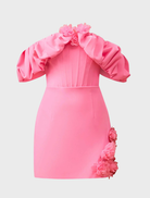 Feminine pink mini dress featuring an off-the-shoulder style and fitted design, perfect for a night out or special event.