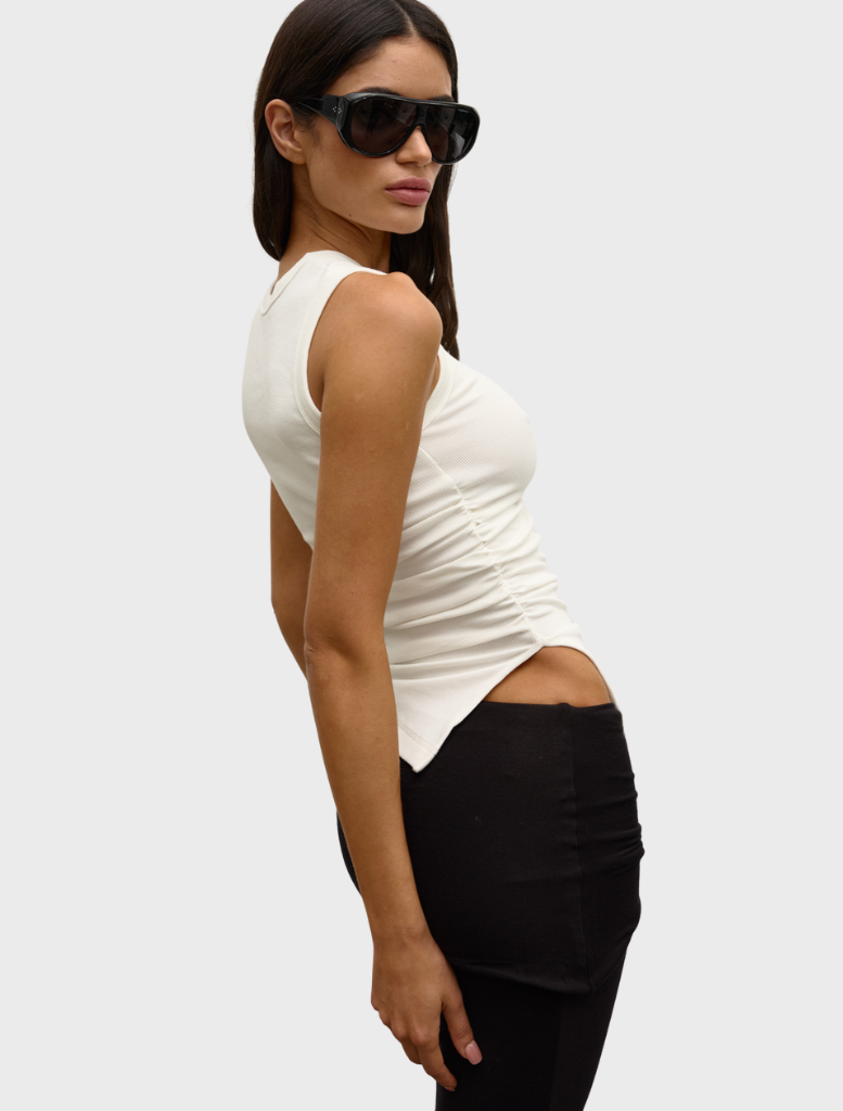 White Lana Rouched Tank showcasing a chic ruched style, suitable for various outfits and occasions.