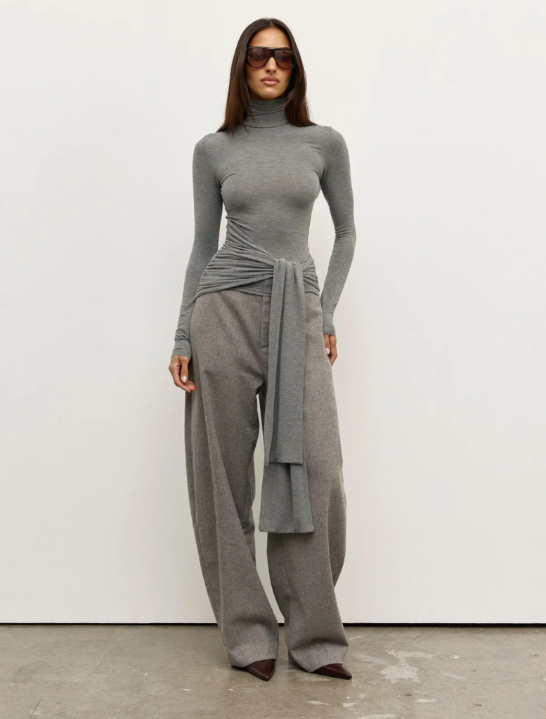A light grey marle Isley top hanging, featuring a simple and elegant style suitable for everyday wear.