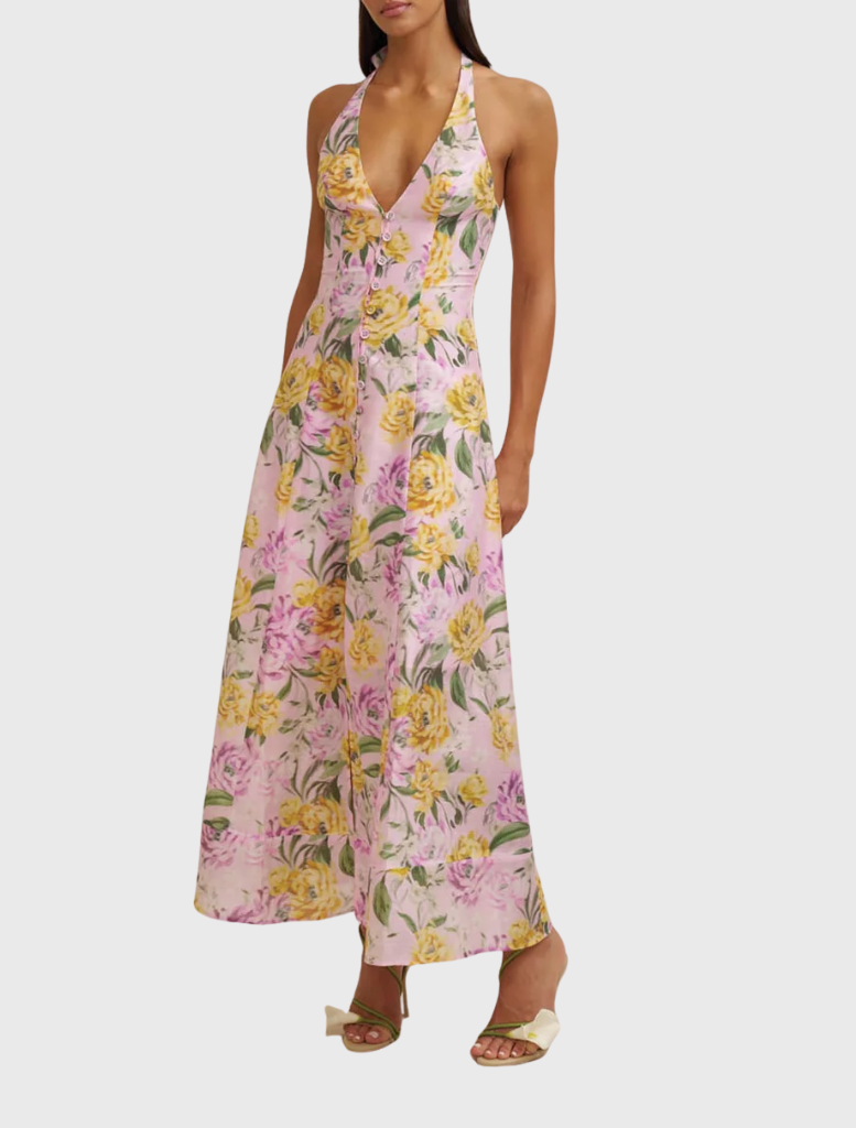 Lilac floral sundress on a model, highlighting a sleeveless design and modern silhouette, ideal for warm-weather styling.
