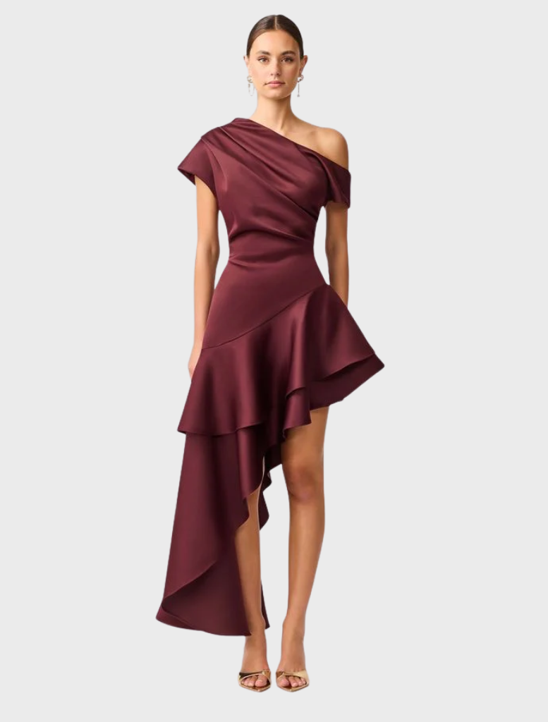 Burgundy satin Livia Gown with an asymmetric hem, elegantly draping for a sophisticated look.