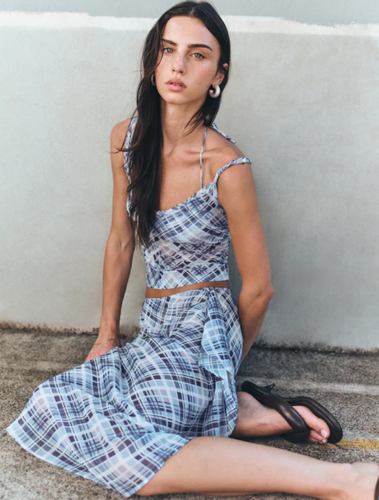 Elegant London wrap skirt in sky plaid, showcasing a versatile and fashionable look for various events.