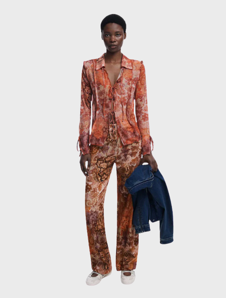 Long orange trousers displayed on a white background, showcasing a casual and vibrant style for everyday wear.