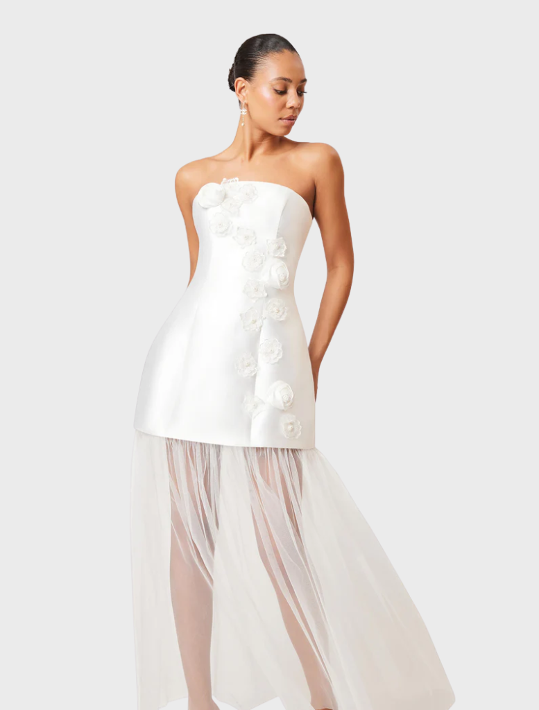 White strapless maxi dress with an oleander floral pattern, perfect for summer events and casual outings.