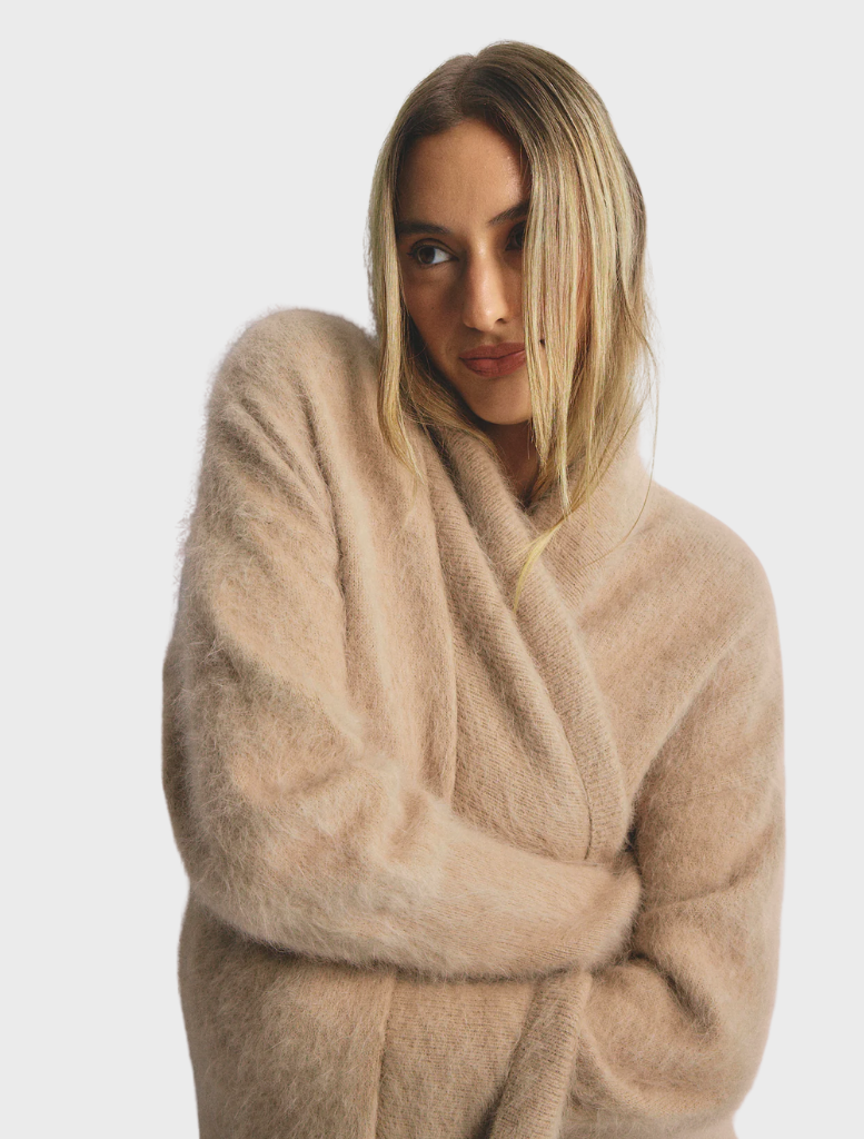 Latte-colored Sophia Open Cashmere Cardigan, featuring a relaxed fit and soft texture, perfect for layering in cooler weather.