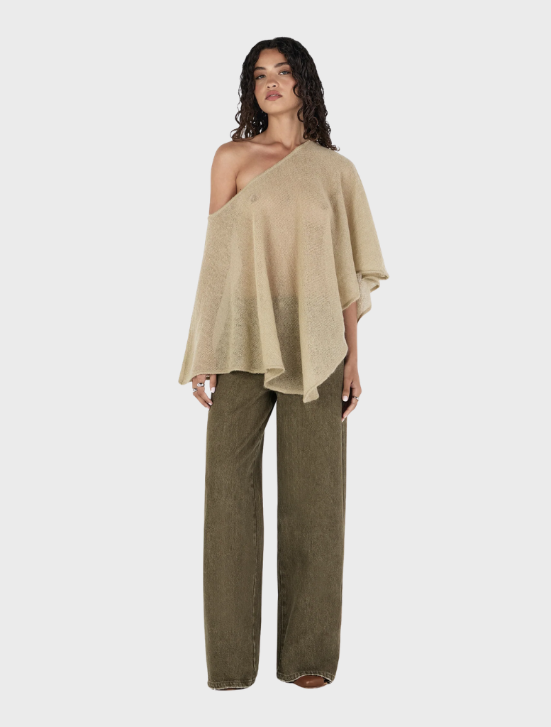 Simona Poncho in a soft pistachio hue, perfect for layering and adding a pop of color to outfits.