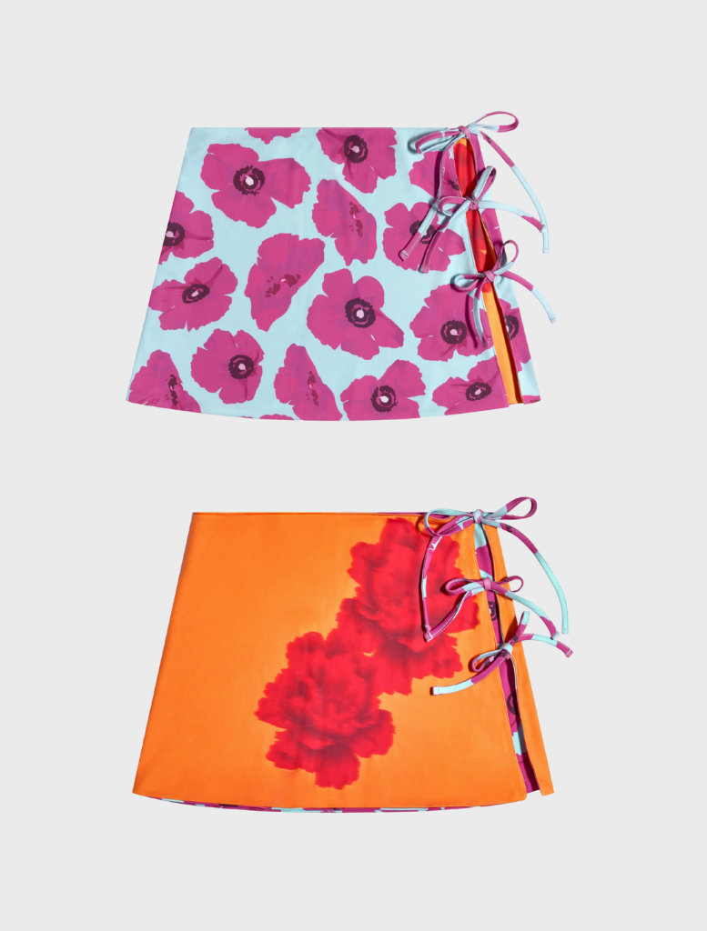 Two skirts featuring vibrant floral patterns in various colors, showcasing a lively and cheerful design.