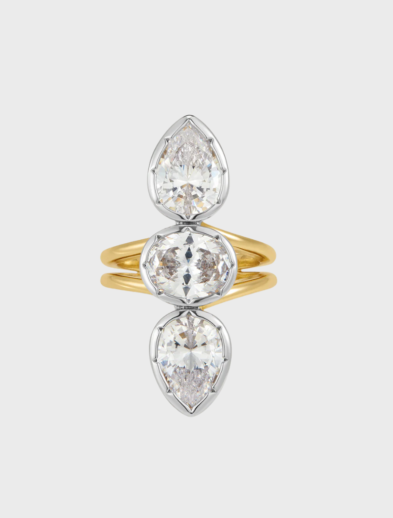 A gold and white gold diamond ring featuring three stones, named the Marais Triple Statement Ring.