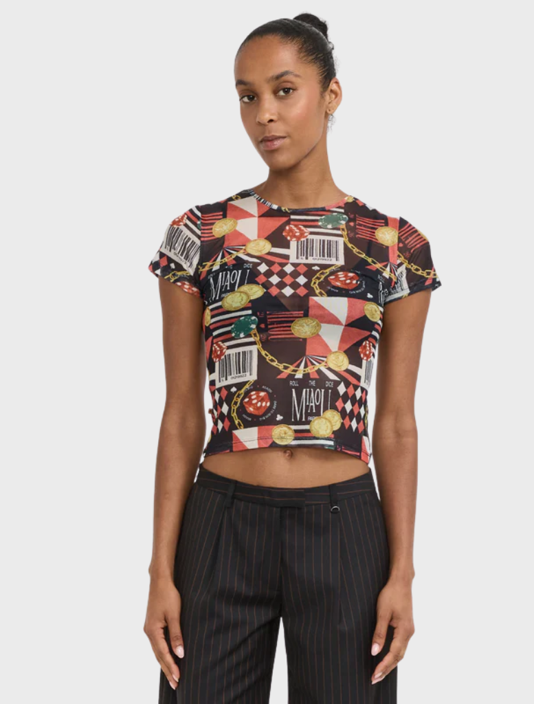 A mini tee featuring a casino theme, showcasing playing cards and dice in vibrant colors.