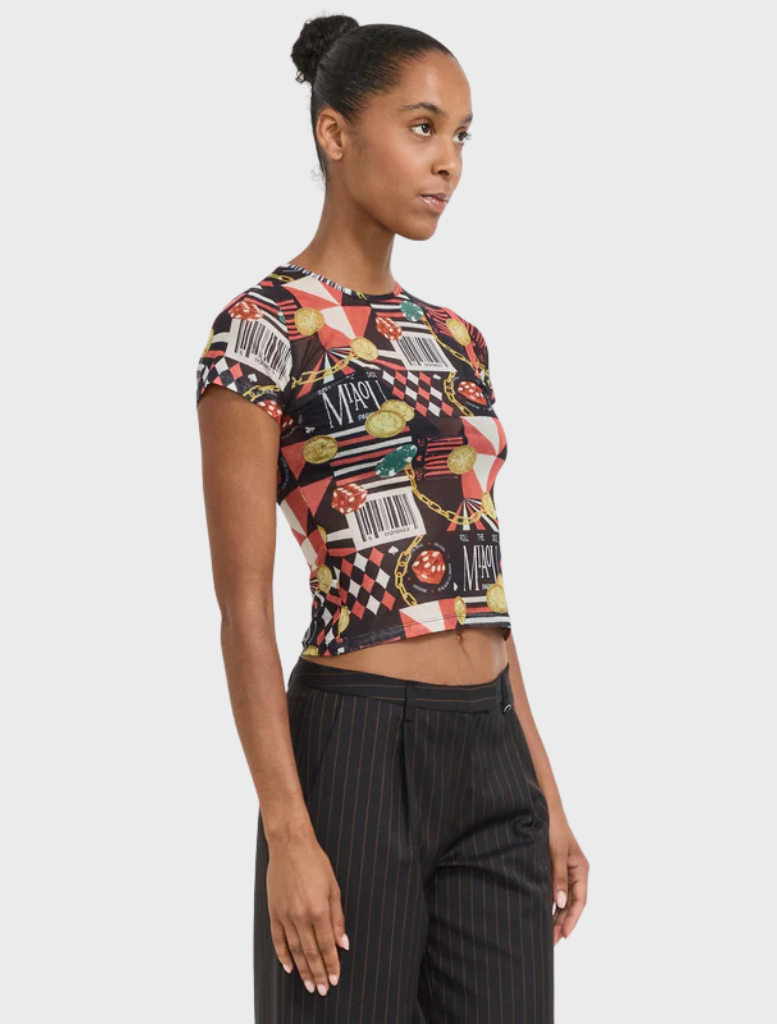 A casino-themed mini tee, adorned with bright illustrations of playing cards and dice.