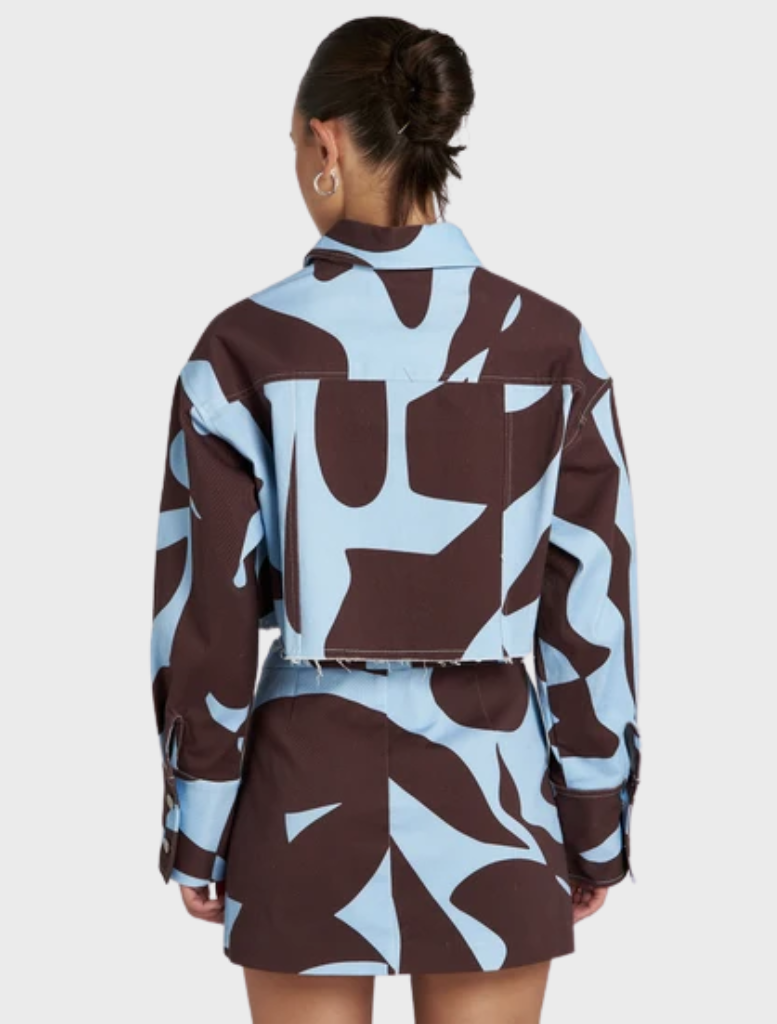 Contemporary Cropped Shacket with abstract Mirage design in brown and blue, perfect for effortless layering and travel.