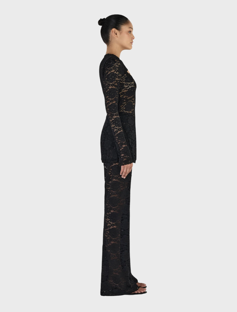 Misha Long Sleeve Top in black, offering a stylish and timeless addition to your clothing collection.