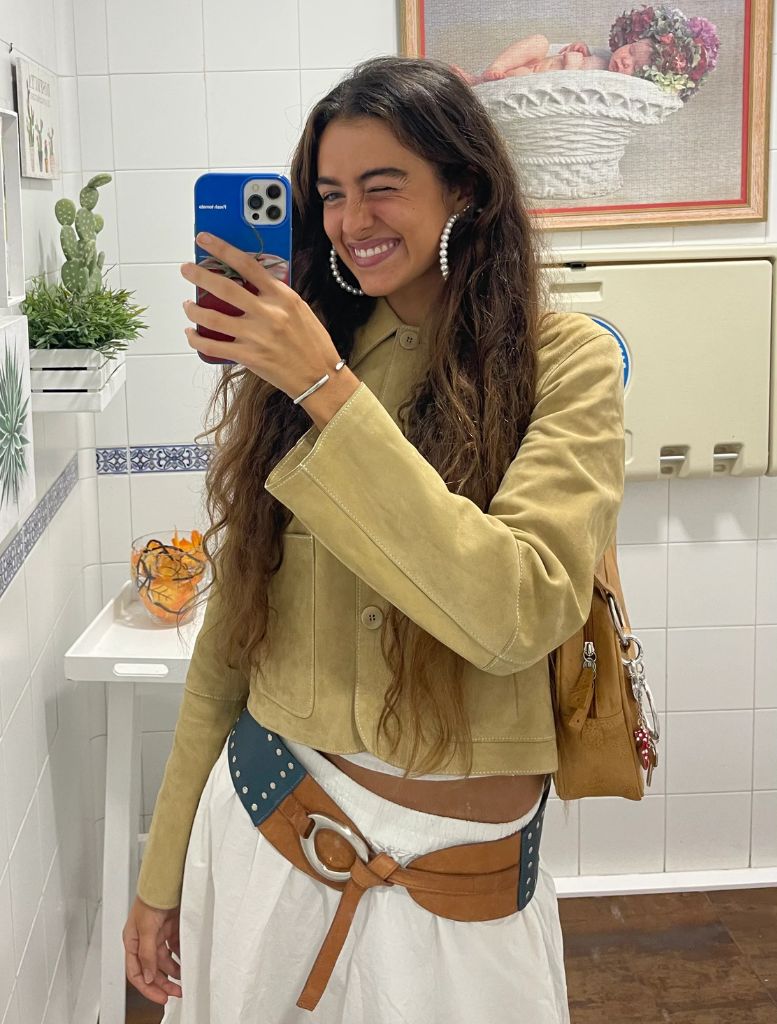 A multicolour Nuvola belt showcasing a buckle and dual straps for adjustment.