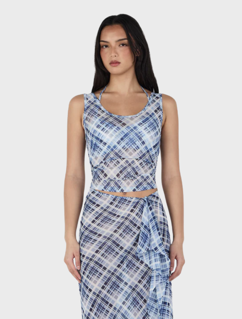 Natalia Layer's sky plaid tank top, showcasing a light blue and white checkered pattern for a fresh summer look.