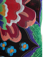 A neutral grey Swim Jungle Dress draped elegantly, emphasizing its casual style and eye-catching tropical details.