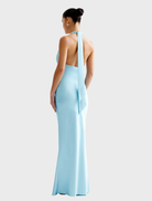 The Novia Dress in Glacier, characterized by its sophisticated style and flowing fabric, ideal for formal wear.