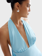 Light blue Novia Dress in Glacier, featuring a flowing silhouette and delicate fabric, perfect for elegant occasions.