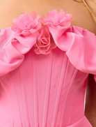 Chic pink off-the-shoulder mini dress with a flattering fit, designed for warm weather and stylish occasions.