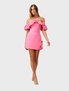 Pink off-the-shoulder mini dress featuring a fitted silhouette and short sleeves, perfect for casual or semi-formal occasions.