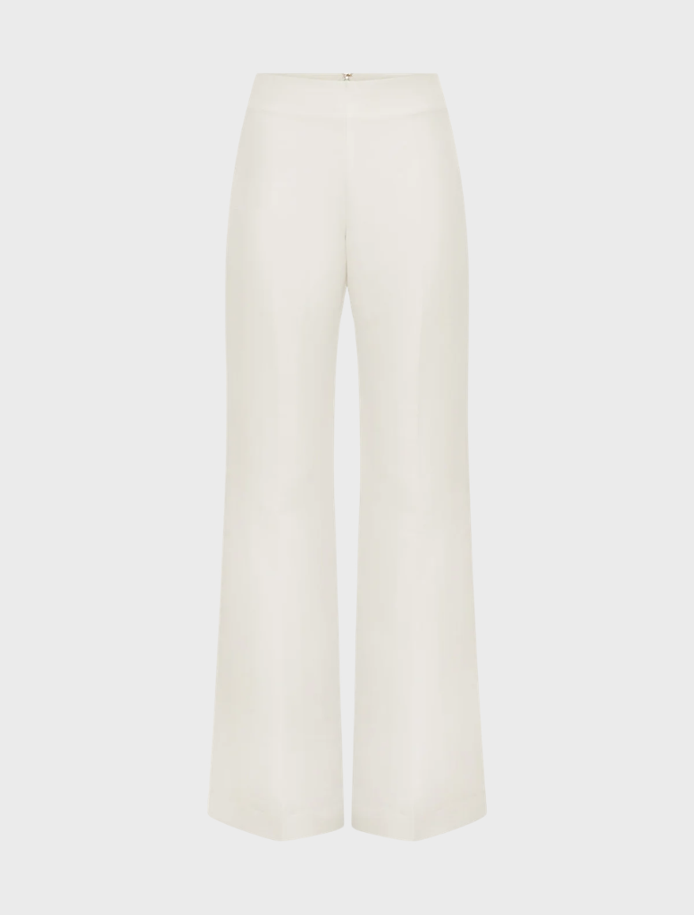 Ivory Otis Pant, illustrating its fit and overall aesthetic in a casual setting.