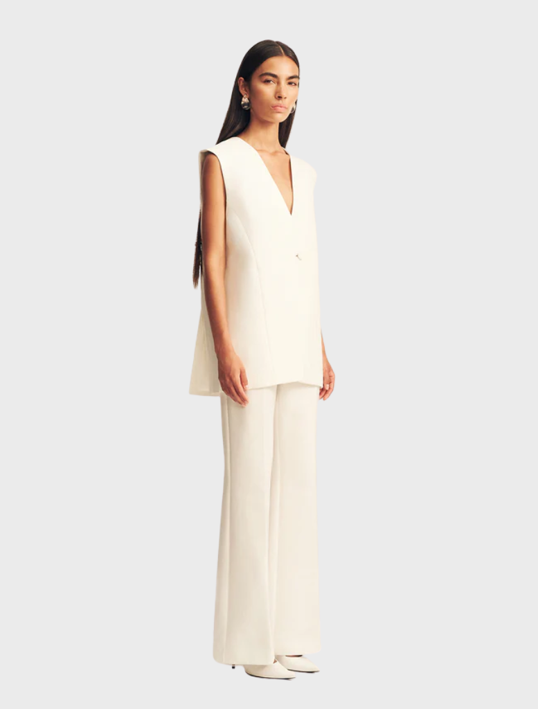Elegant ivory sleeveless blazer from Otis, designed for a polished look in both professional and casual settings.