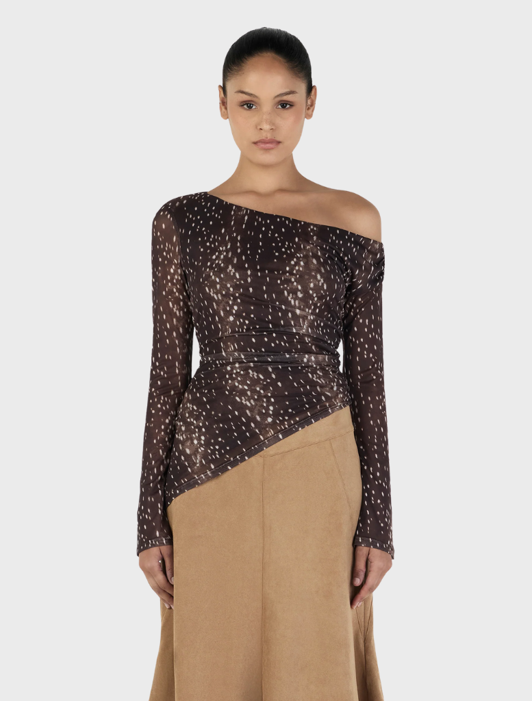 Long sleeve top featuring a Bambi print, designed for a stylish and playful look. Perfect for casual wear.