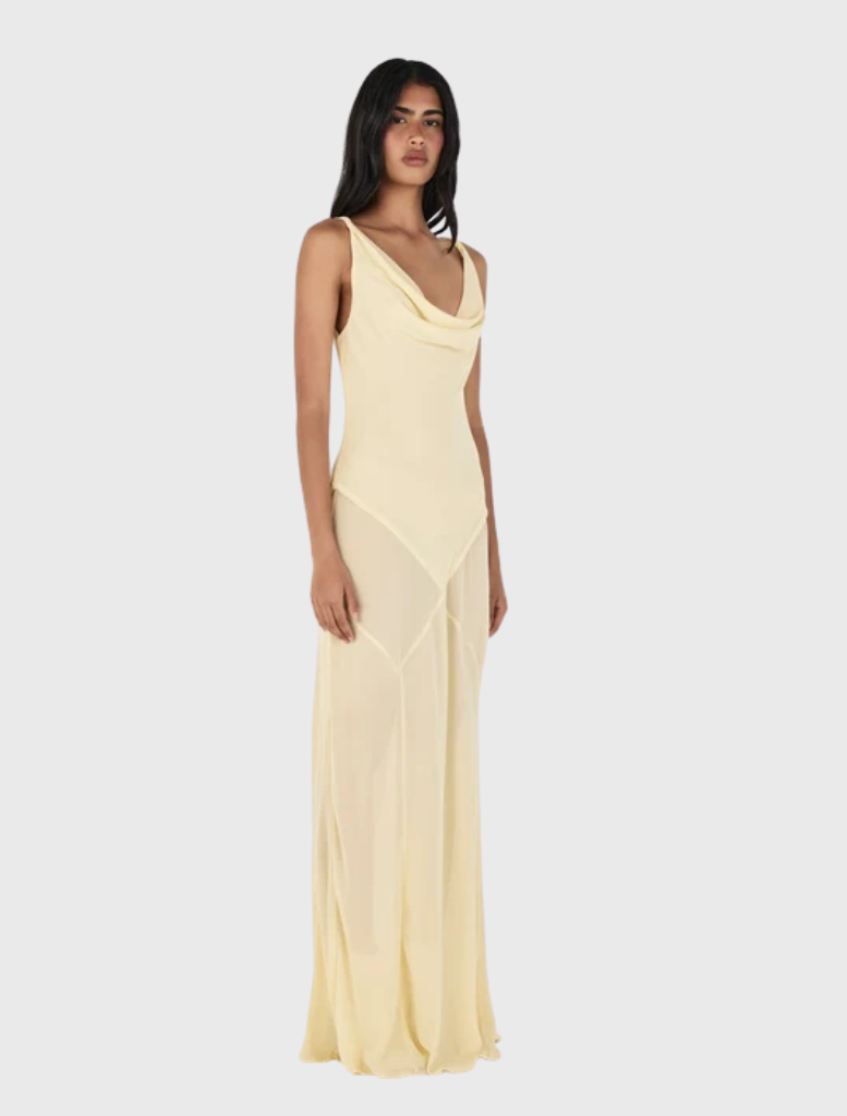 Butter yellow maxi dress featuring a draped cowl neckline, twist strap detail, and a panelled bias-cut skirt for movement.