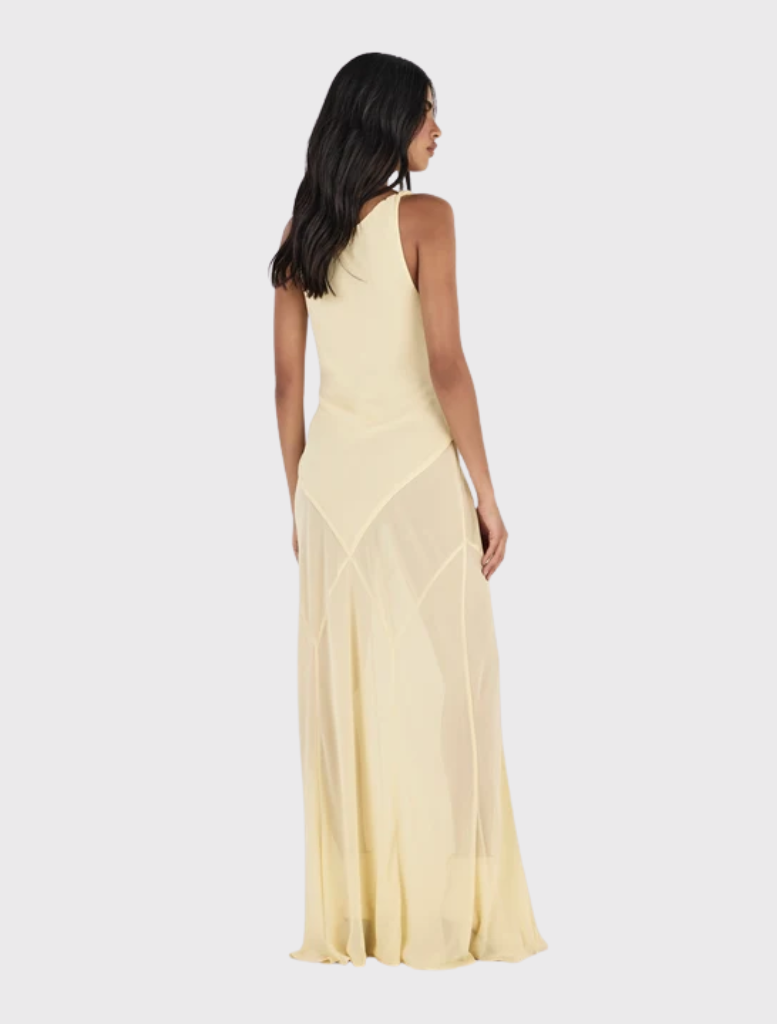 Stylish butter yellow maxi dress with a draped cowl neckline, twist straps, and a relaxed fit panelled bias-cut skirt.
