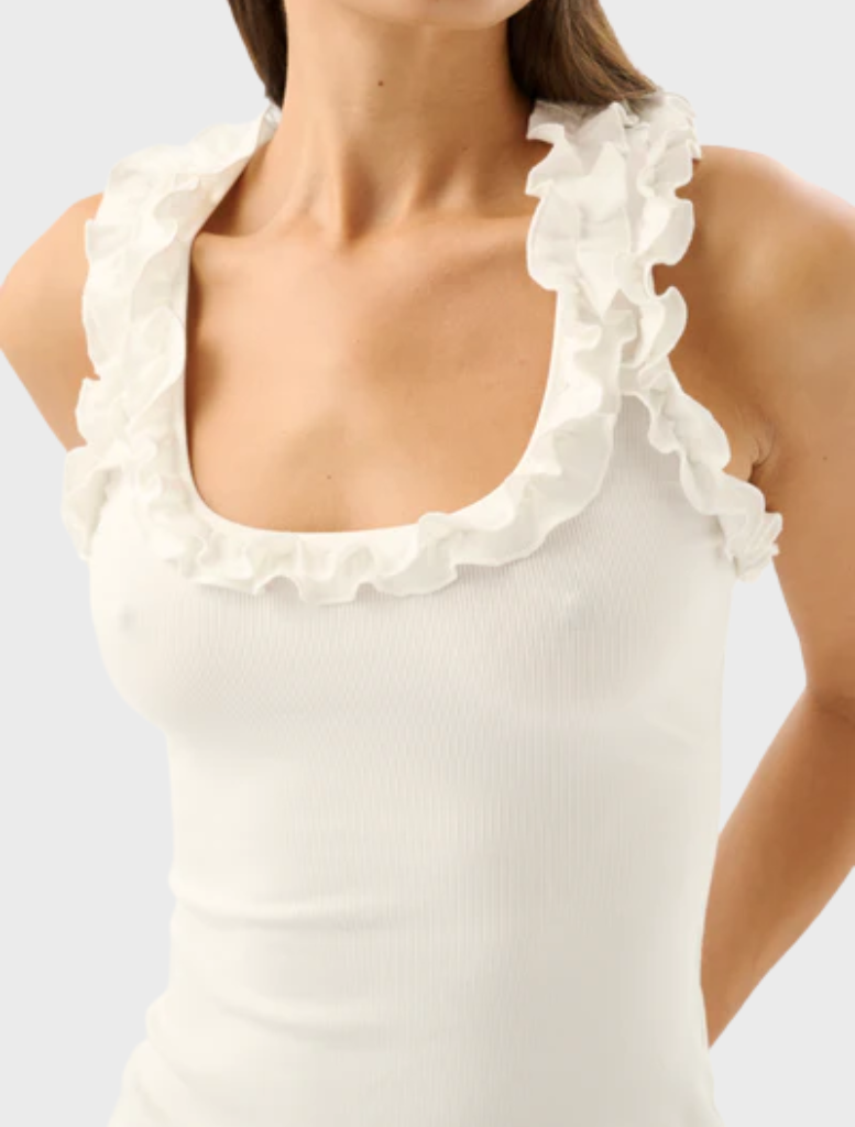 The Paloma Tank in ivory, presented on a model, illustrating its comfortable fit and stylish simplicity for casual occasions.