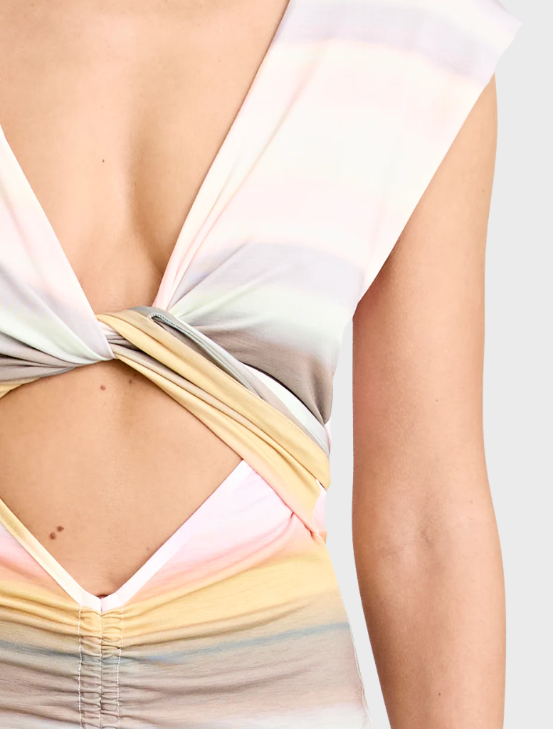 Peach Elara Dress showcasing a stylish cut and soft fabric, ideal for summer events or everyday wear.