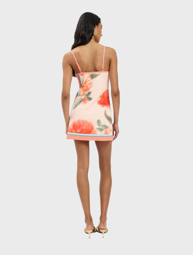 Peach floral fitted mini dress, featuring a vibrant print and a tailored silhouette for a chic look.