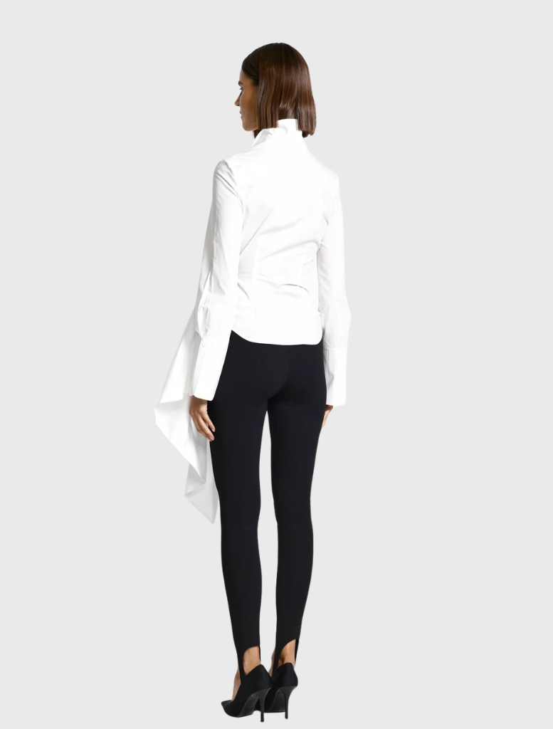 Elegant white Phillipa Shirt with a high collar, long sleeves, and a waist tie, designed for a refined, asymmetrical look.