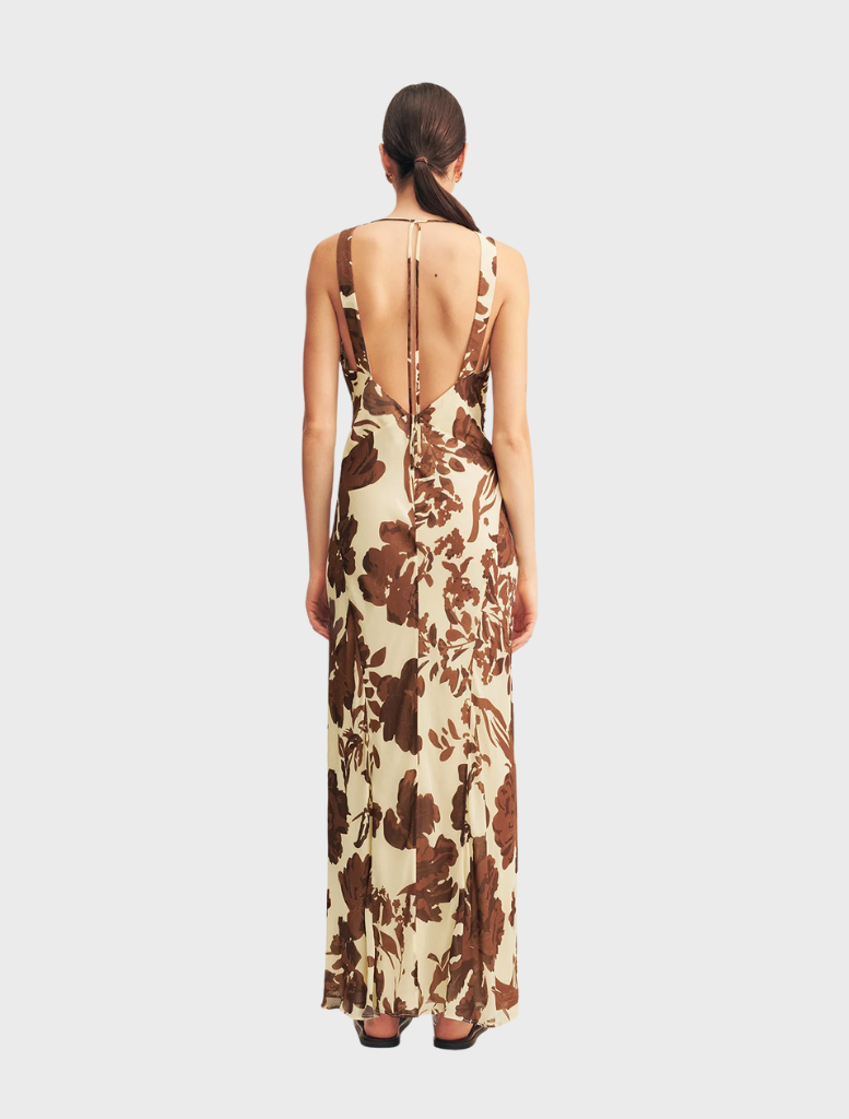 Beautiful Noa Plunged Maxi Dress highlighted by a striking Pineapple Wallflower print, perfect for outdoor gatherings.